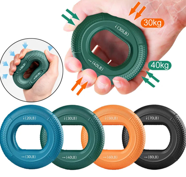 Hand holding a green resistance ring with load indicators, surrounded by other resistance rings in different colors and weights.